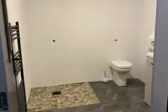 Family washroom with spacious shower and towel railing