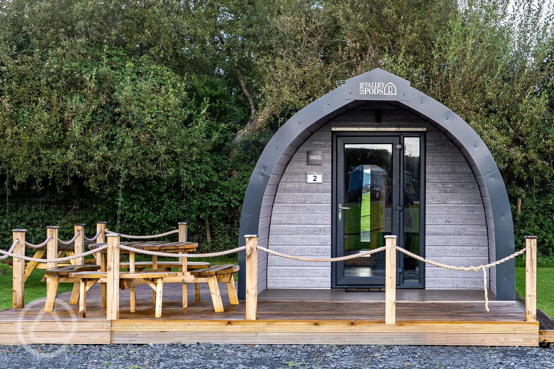 Mega glamping pod with a parking space and decking area
