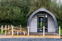 Mega glamping pod with a parking space and decking area
