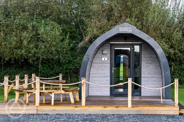 Mega glamping pod with a parking space and decking area