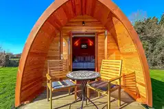 Camping pod (two person) with small decking and outdoor seating Camping pod (two person) with small decking and outdoor seating