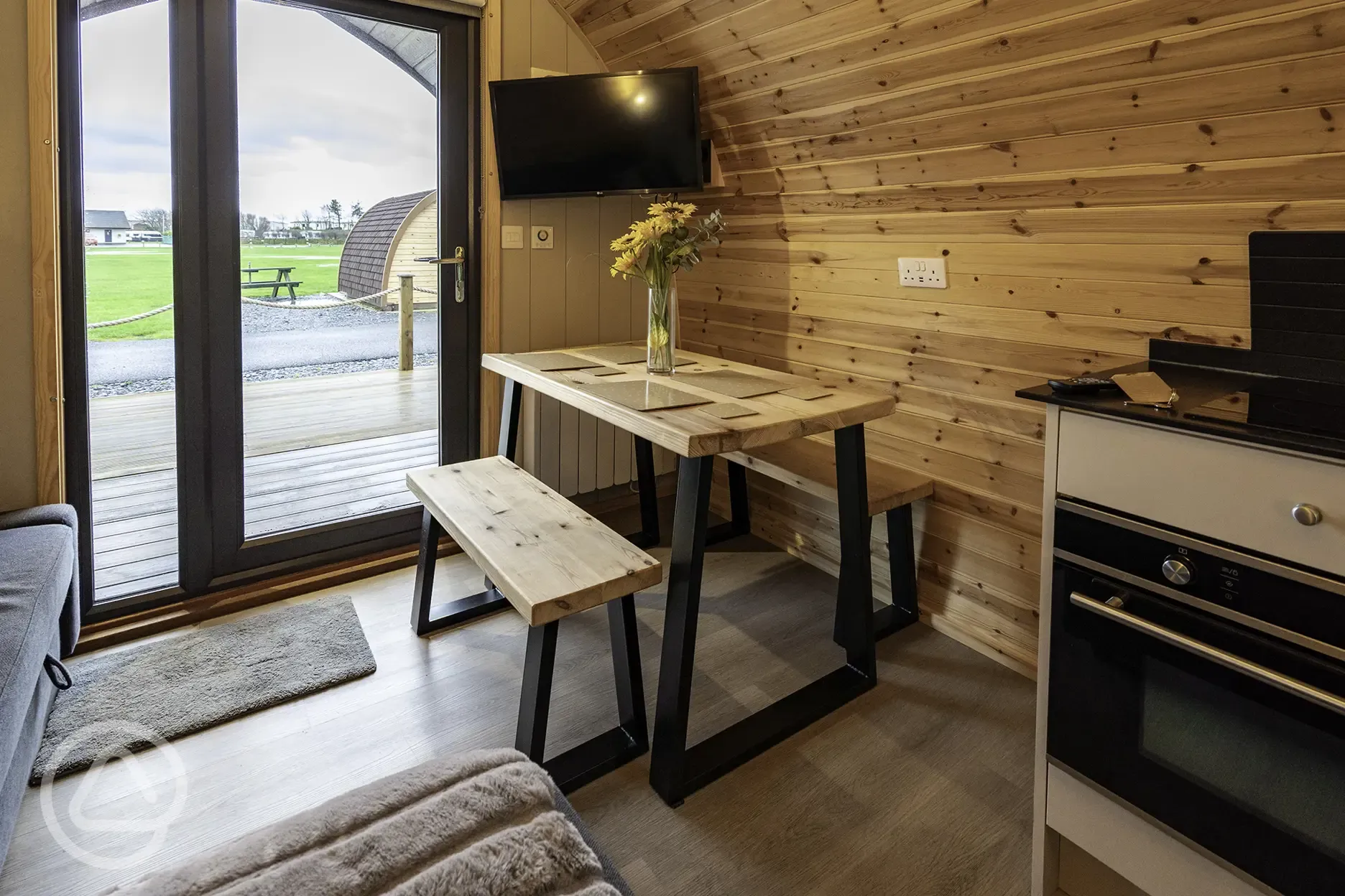 Mega glamping pod dining area for four people