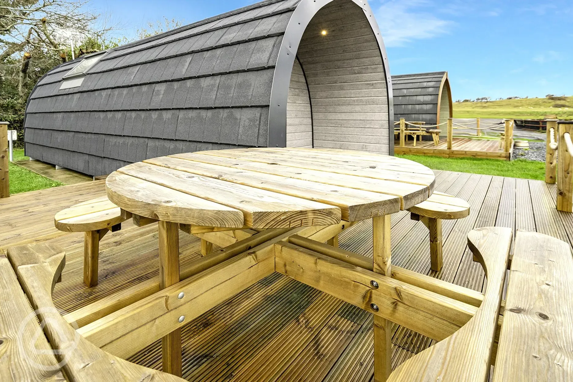 Mega glamping pod with outdoor deck and bench