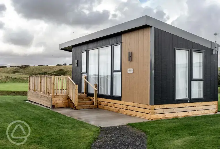 Glamping S-pod with a raised deck area