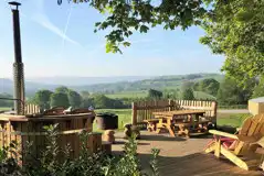 Luxury bell tent outdoor view and wood-fired hot tub