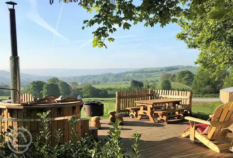 Luxury bell tent outdoor view and wood-fired hot tub