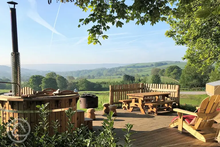 Luxury bell tent outdoor view and wood-fired hot tub