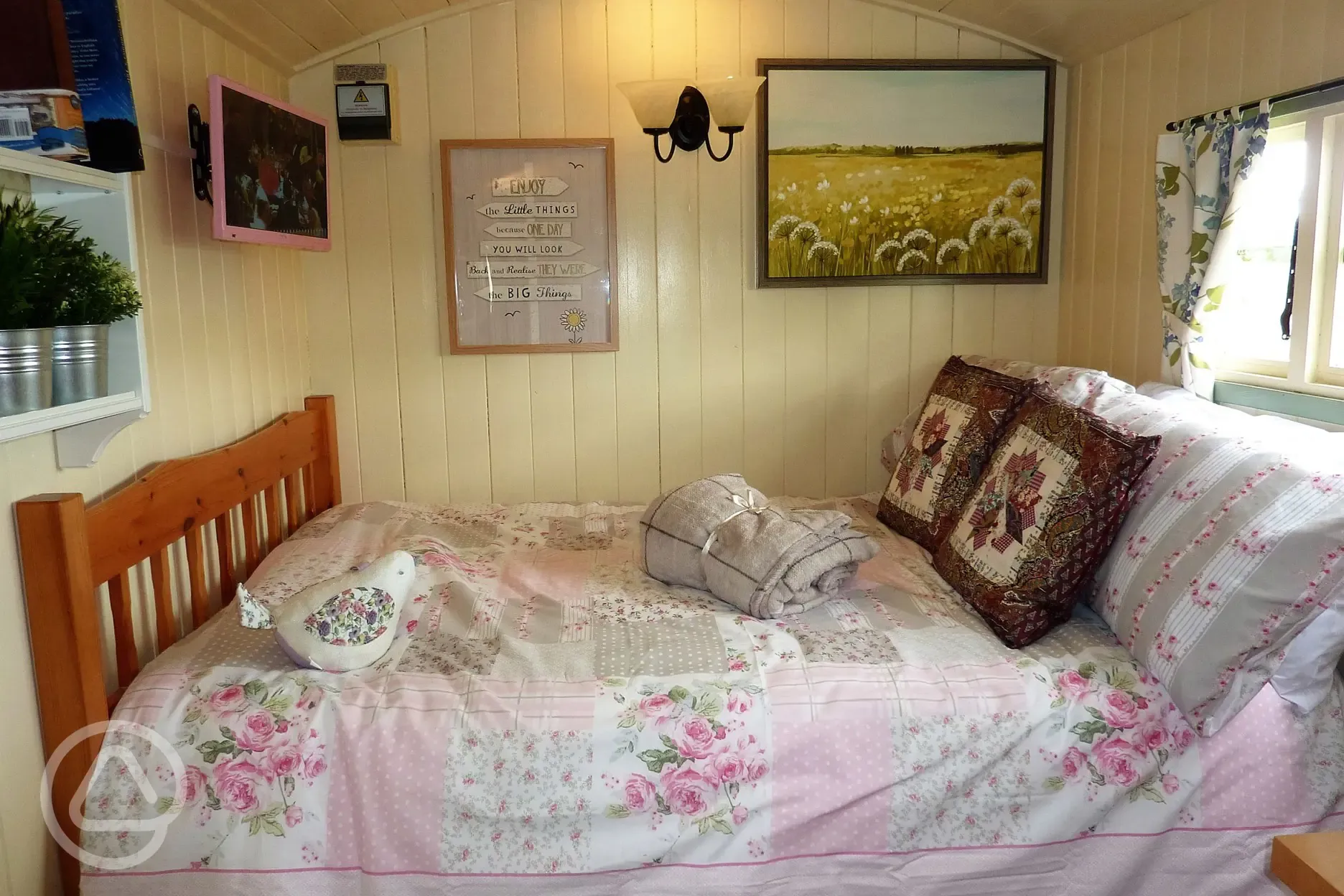 Bed inside the Shepherds Hut at The Buteland Stop