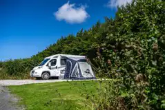 Fully serviced hardstanding pitch with grass area