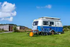 Electric grass pitches by the facility building