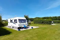 Fully serviced hardstanding pitches with privacy hedging