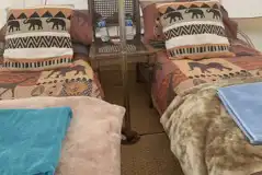 Safari bell tent interior with towels and bedding Safari bell tent interior with towels and bedding