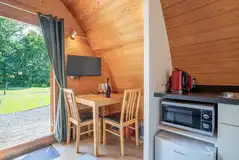Bunny ensuite glamping pod dining area and TV