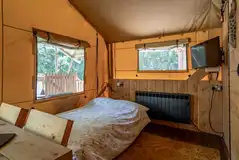 Ensuite safari tent living area with sofa bed Ensuite safari tent living area with sofa bed