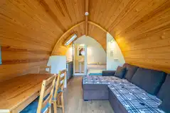 Bambi ensuite glamping pod sofa bed and dining area Bambi ensuite glamping pod sofa bed and dining area