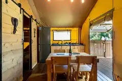 Ensuite safari tent kitchen and dining area Ensuite safari tent kitchen and dining area