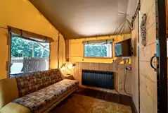 Ensuite safari tent living area with a Smart TV Ensuite safari tent living area with a Smart TV