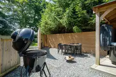 Ensuite safari tent BBQ and hot tub area Ensuite safari tent BBQ and hot tub area