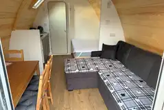 Ensuite glamping pod - interior with a double bed and sofa bed