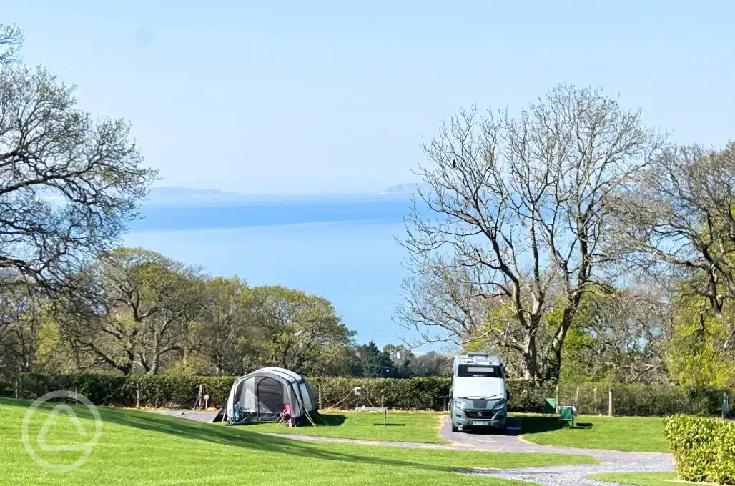 Electric grass and gravel pitches overlooking Penmaenmawr Beach
