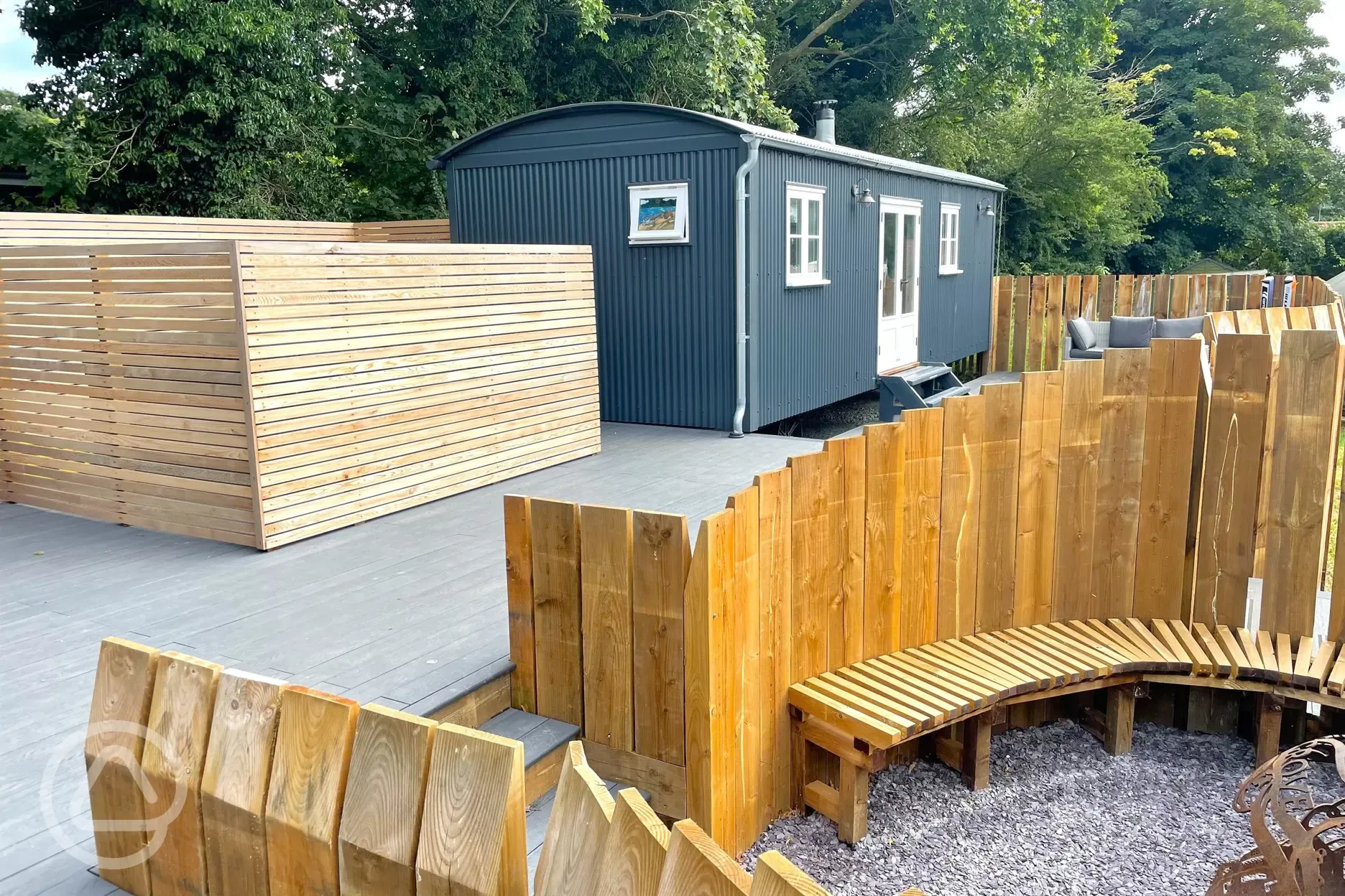 Shepherd's hut and outdoor seating area