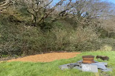 Dyfi pitch, soft wood chip and grass