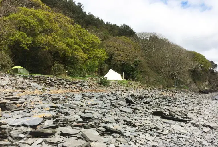 A view of Smugglers Cove Camping pitches from the water