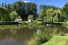 Electric grass touring pitches with lake views