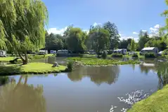 Electric grass touring pitches with lake views