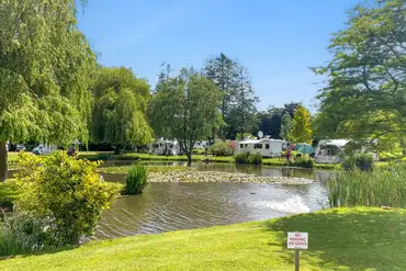 Electric grass touring pitches with lake views