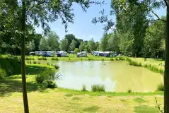 Electric grass touring pitches with lake views