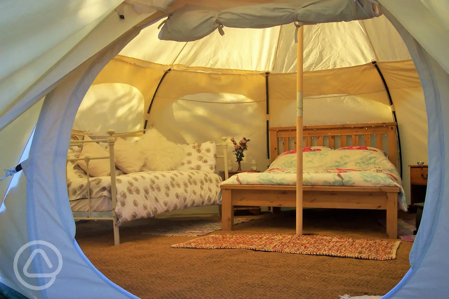 Bell tent interior with double bed