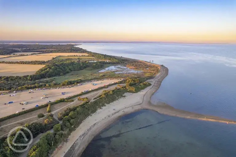 Aerial view of Lepe Beach Campsite and views across Lepe Beach