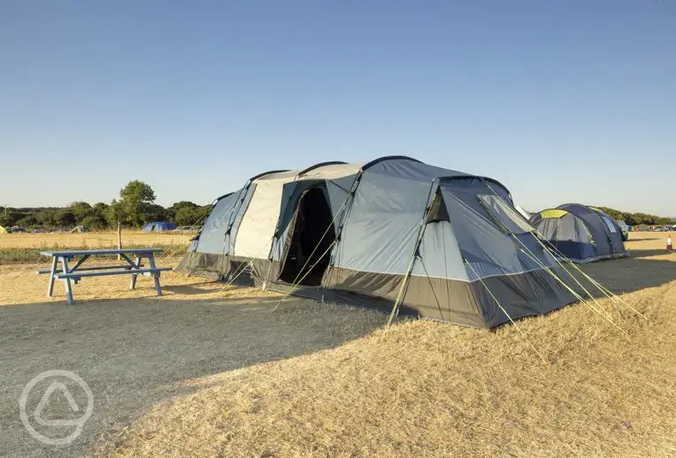Ready tent with picnic bench outside