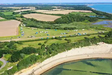 Aerial view of Lepe Beach Campsite and views across Lepe Beach