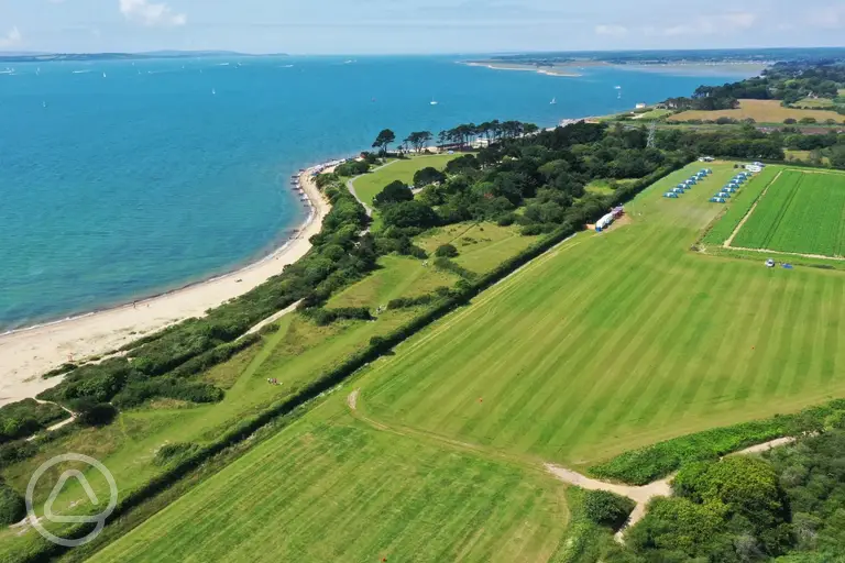 Aerial view of Lepe Beach Campsite and views across Lepe Beach