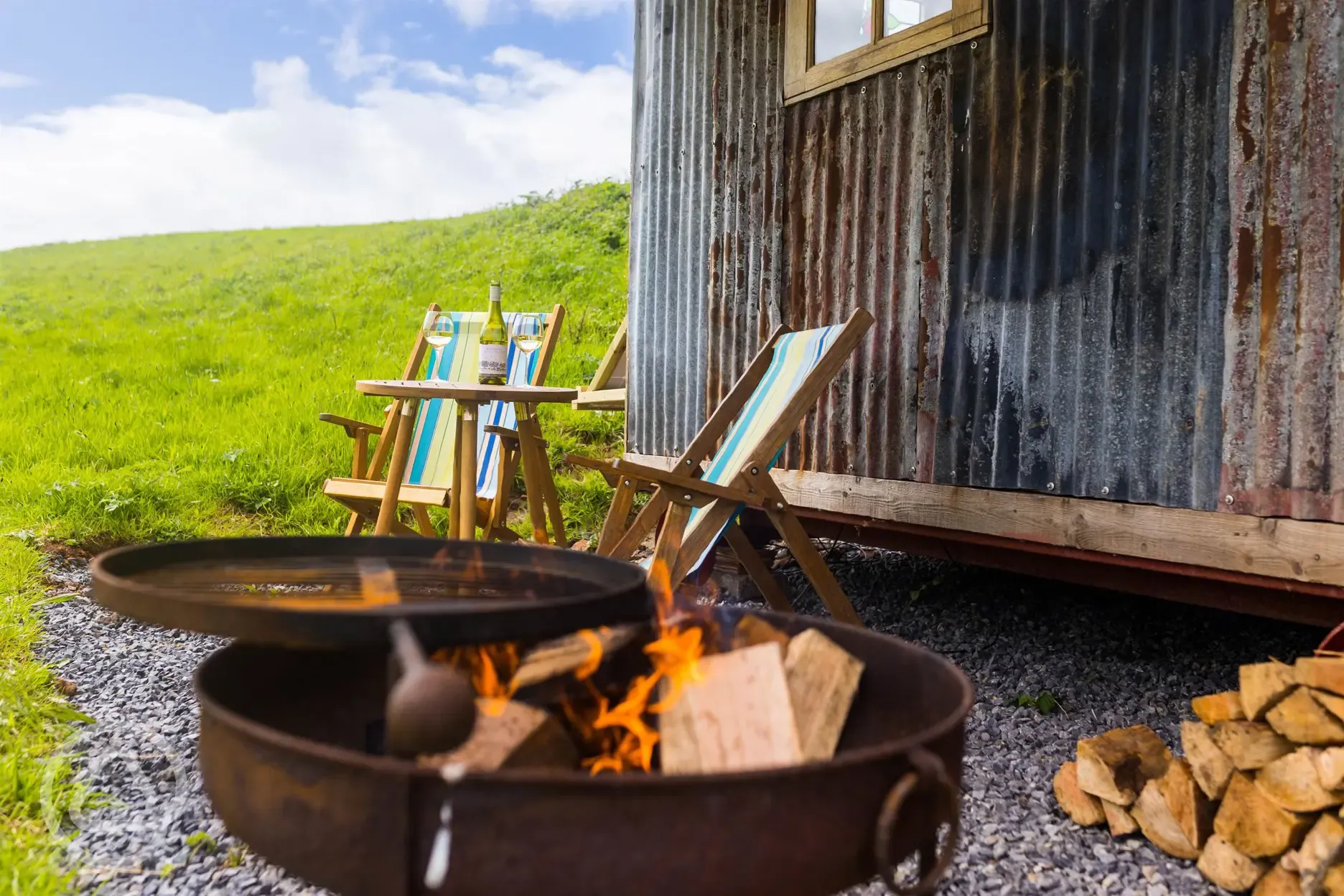 Sand top shepherd's hut fire pit