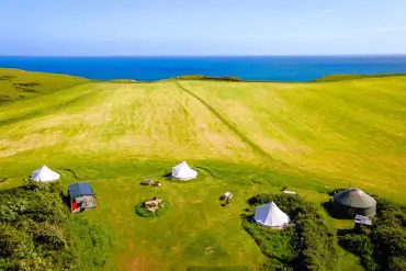 Aerial of Becks Bay Camping and Glamping with coastal views