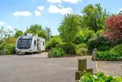 Fully serviced hardstanding pitches with a privacy hedging at Farditch Farm