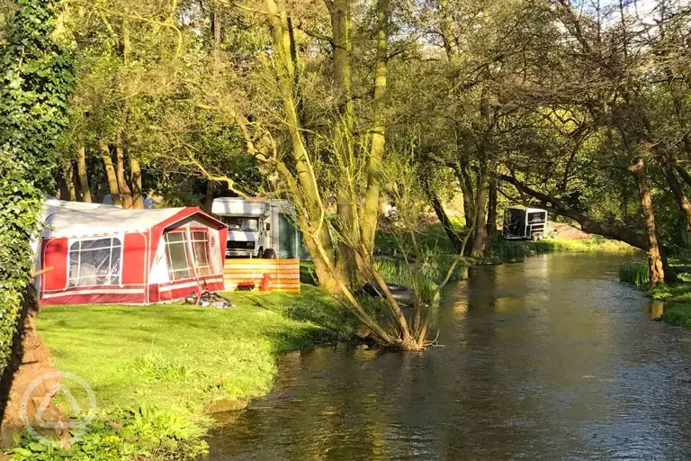 Non electric grass pitches by the River Poulter