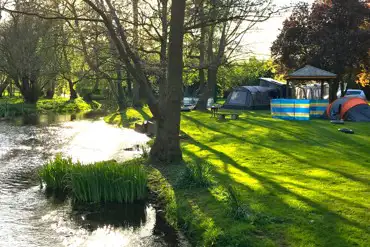 Non electric grass pitches by the River Poulter