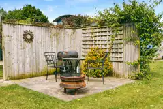 Seating and fire pit outside the shepherd's huts