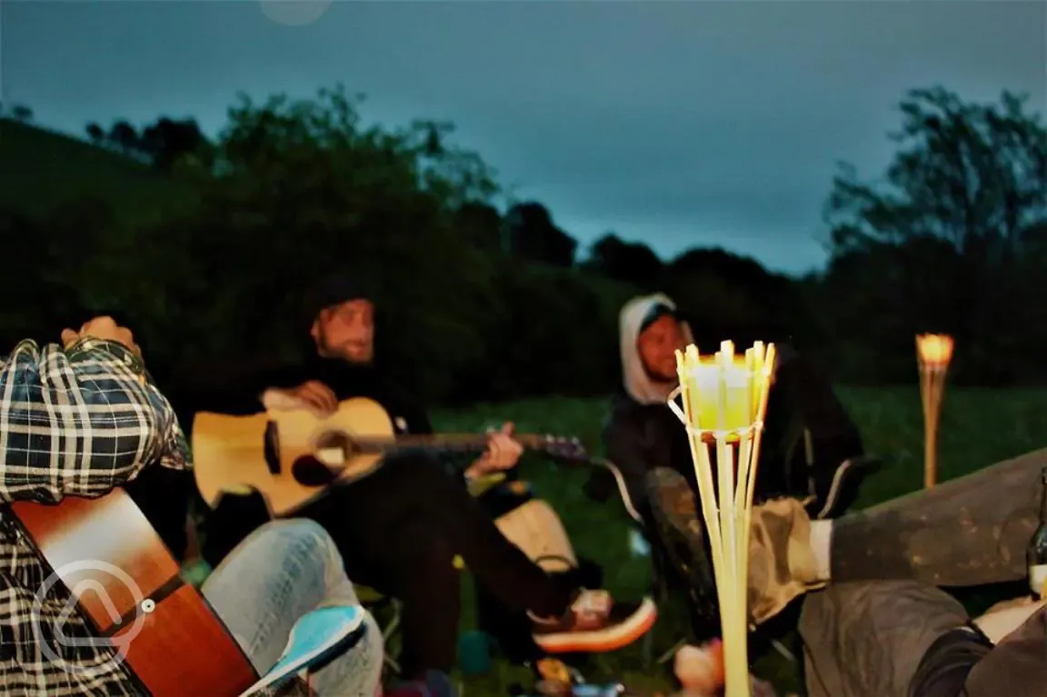 Strumming around the campfire.