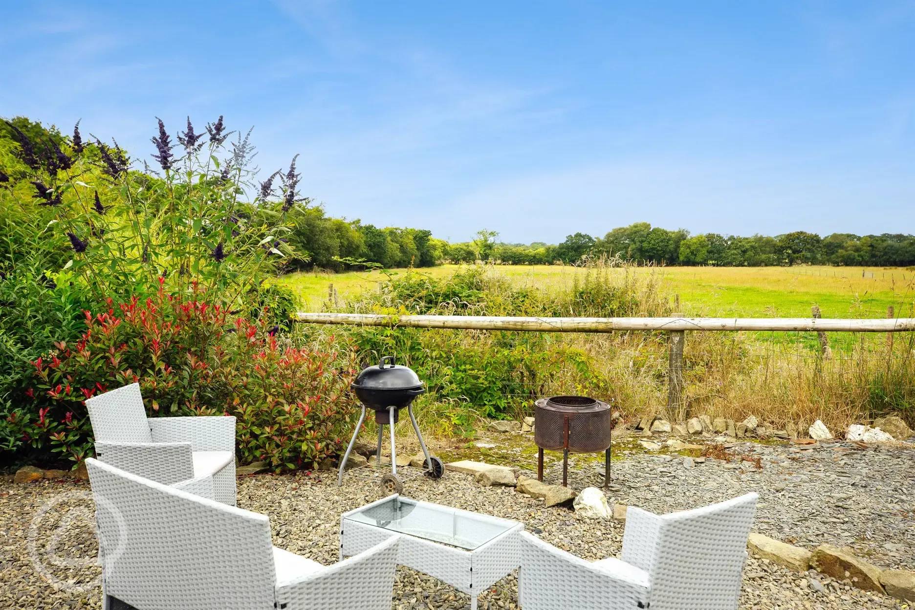 Shepherd's hut outdoor seating and fire pit