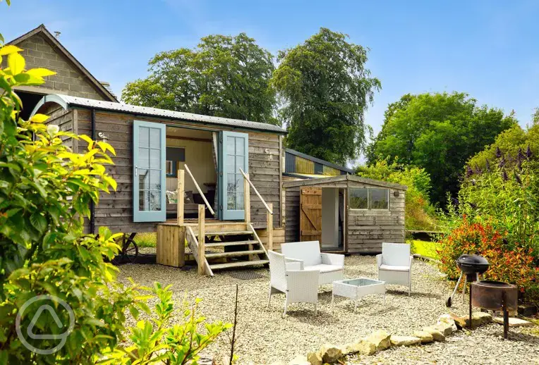 Shepherd's hut outdoor seating, fire pit and BBQ
