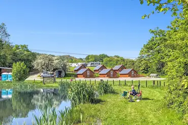 Glamping lodges around the onsite fishing pool (extra cost)