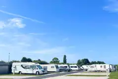 Fully serviced hardstanding pitches with grass areas between