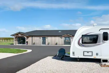 Fully serviced hardstanding pitches and modern facilities block