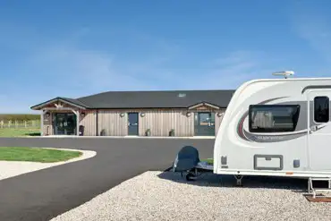 Fully serviced hardstanding pitches and modern facilities block