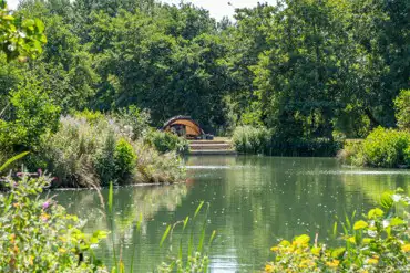 Grass pitches with lakeside views at Burton Springs Holidays